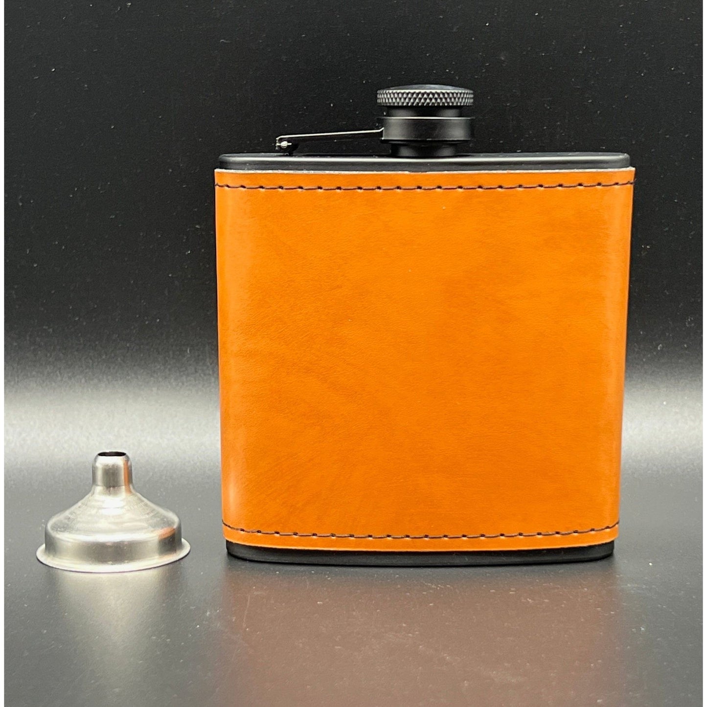 6oz Leather wrapped saddle tan, black stainless steel flask