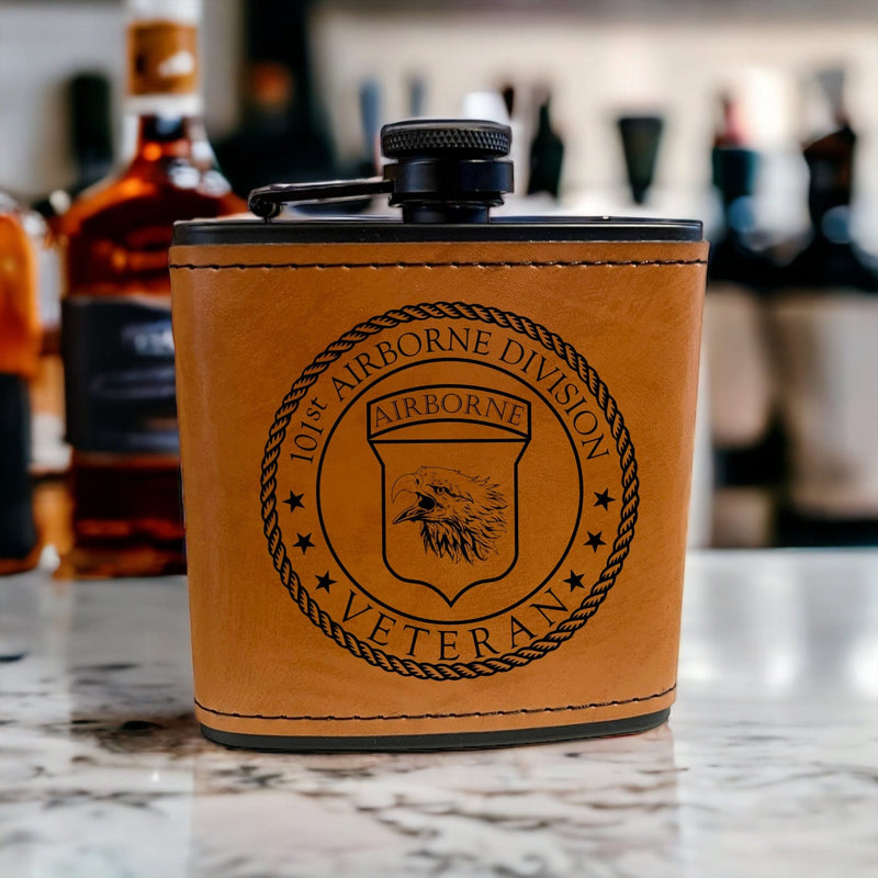 Saddle Tan leather wrapped black stainless steel 6oz Flask featuring the 101st Airborne Veteran logo