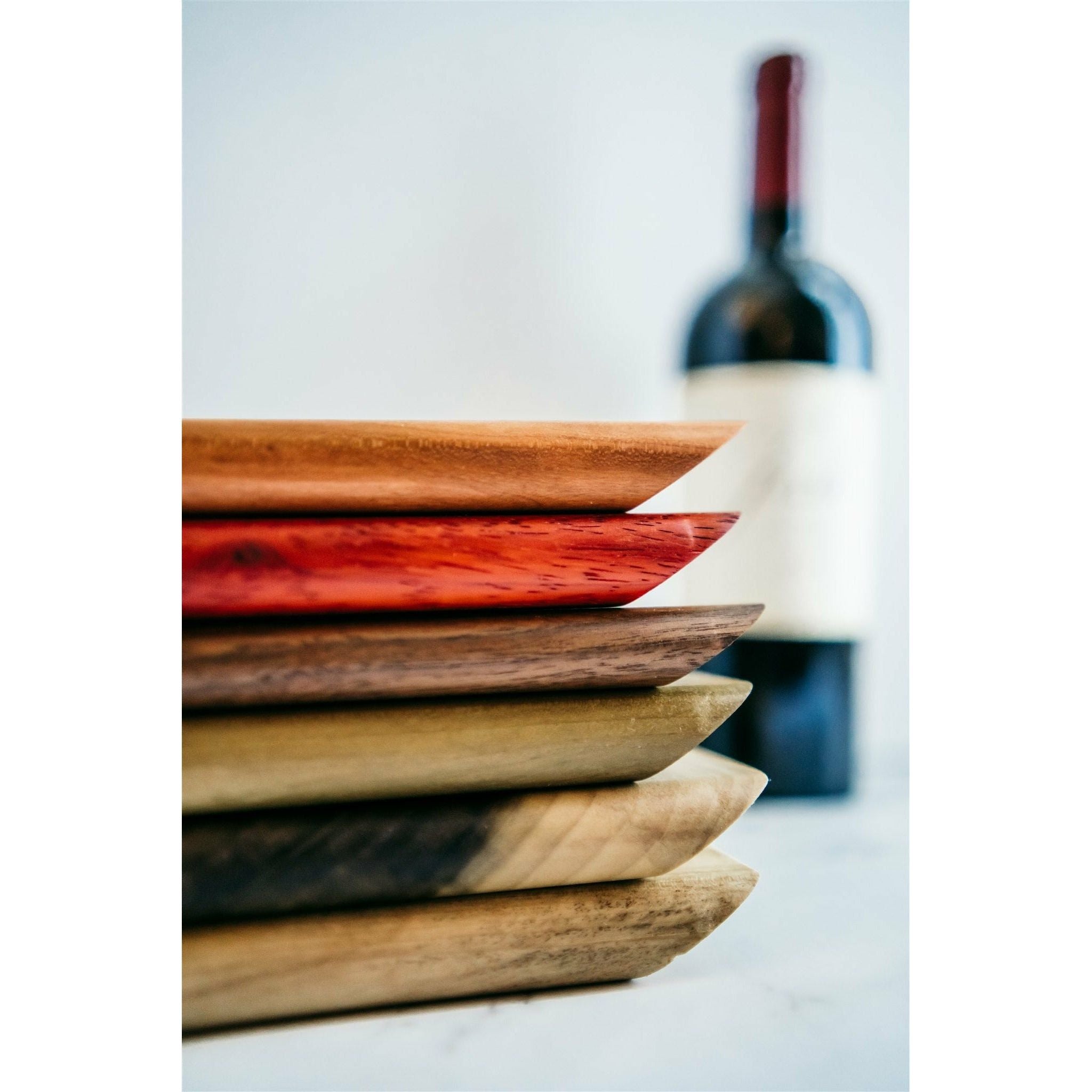 Multiple species of wooden floating wine bottle holder