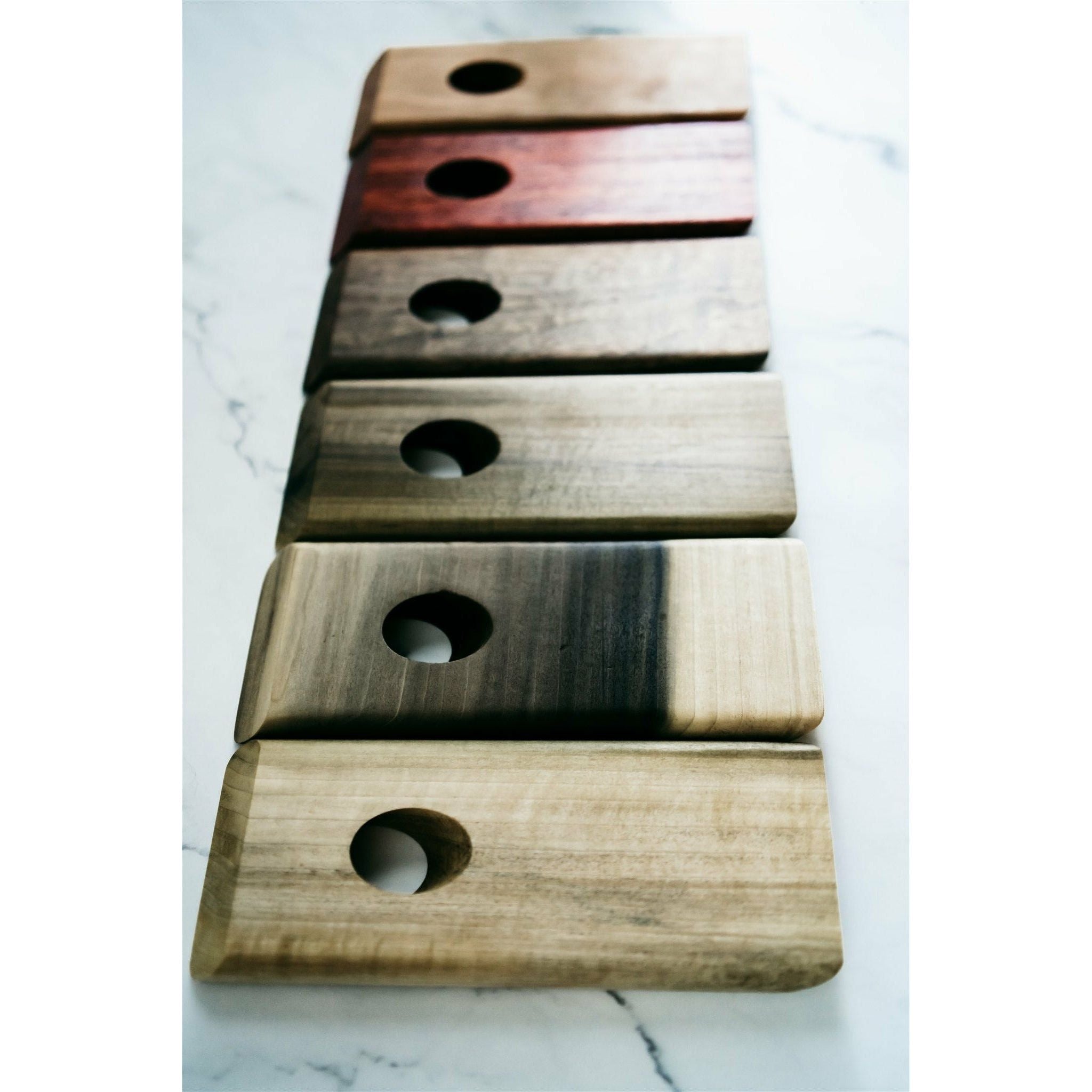 Multiple species of wooden floating wine bottle holder